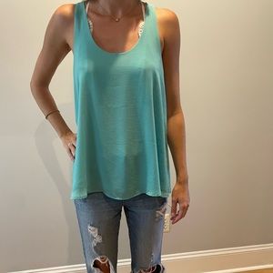 Turquoise flowy tank top with cute back